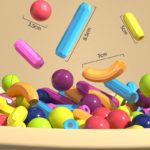 Un bol rempli de Jeu de Construction Magnétique pour Enfants coloré.