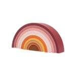 Le jouet arc-en-ciel en silicone composé de plusieurs arches semi-circulaires imbriquées dans des tons de rouge, rose, orange et jaune offre une touche vibrante inspirée de Montessori à n'importe quelle salle de jeux.